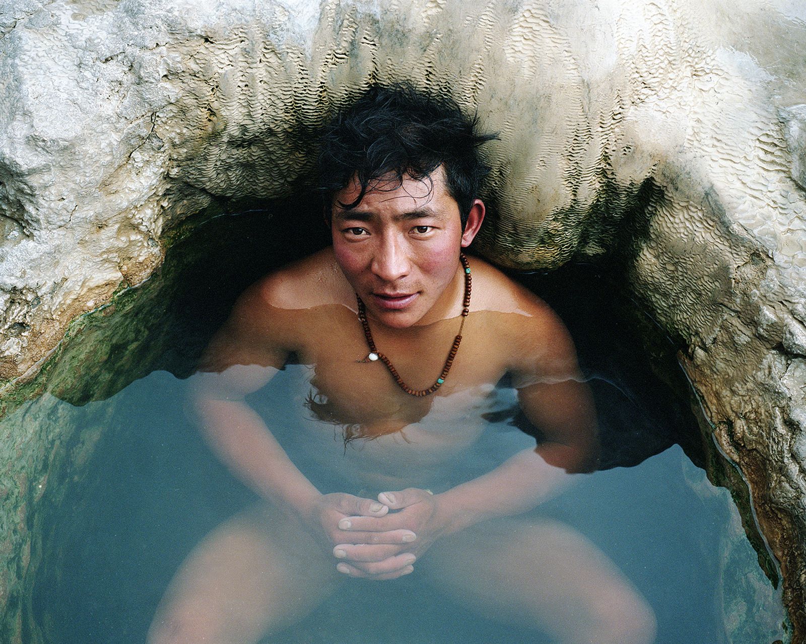 © Hao Wu - A man enjoy a hot spring near Da'na temple. Nangqian, Tibetan Autonomous Prefecture of Yushu, Qinghai province, China, 2018.