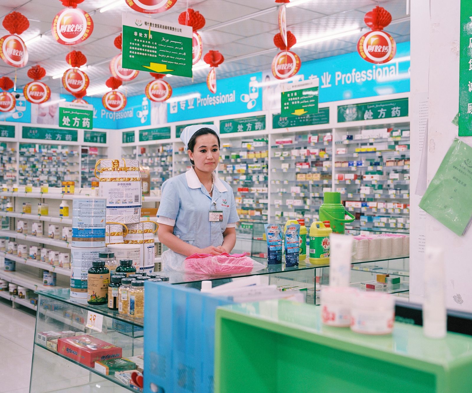 © Patrick Wack - May 2016. Pharmacy clerk in a pharmacy in Kashgar.