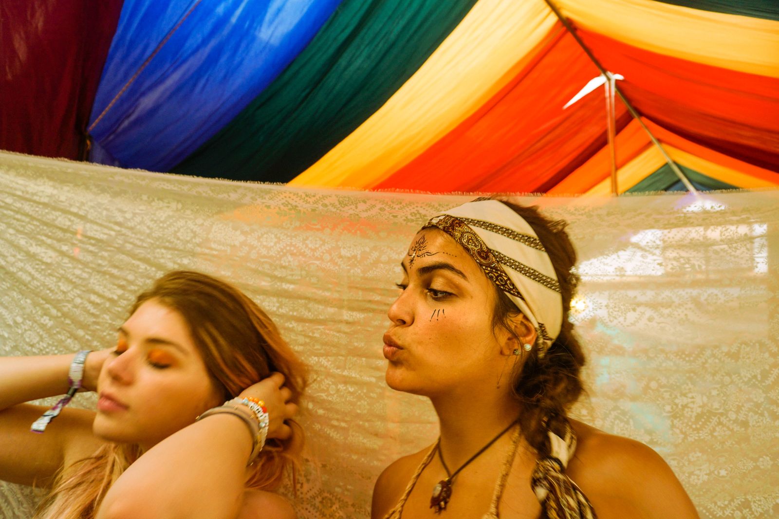 © Samantha Morse - Ragen and Saddie look upon themselves before leaving a colorful dress tent.