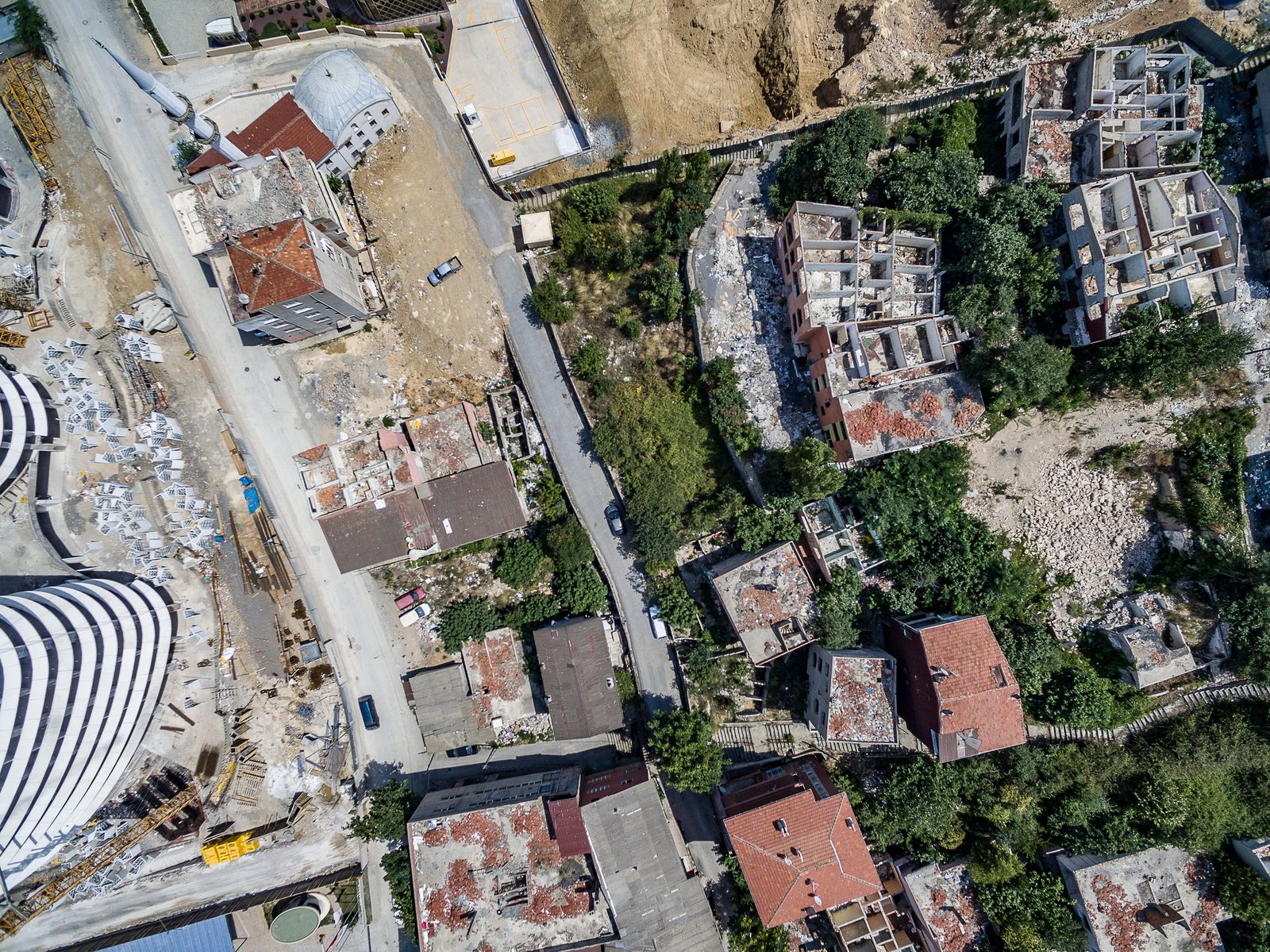 © Murat Germen - Drone photo of the old houses under demolition showing the empty rooms without the roofs.