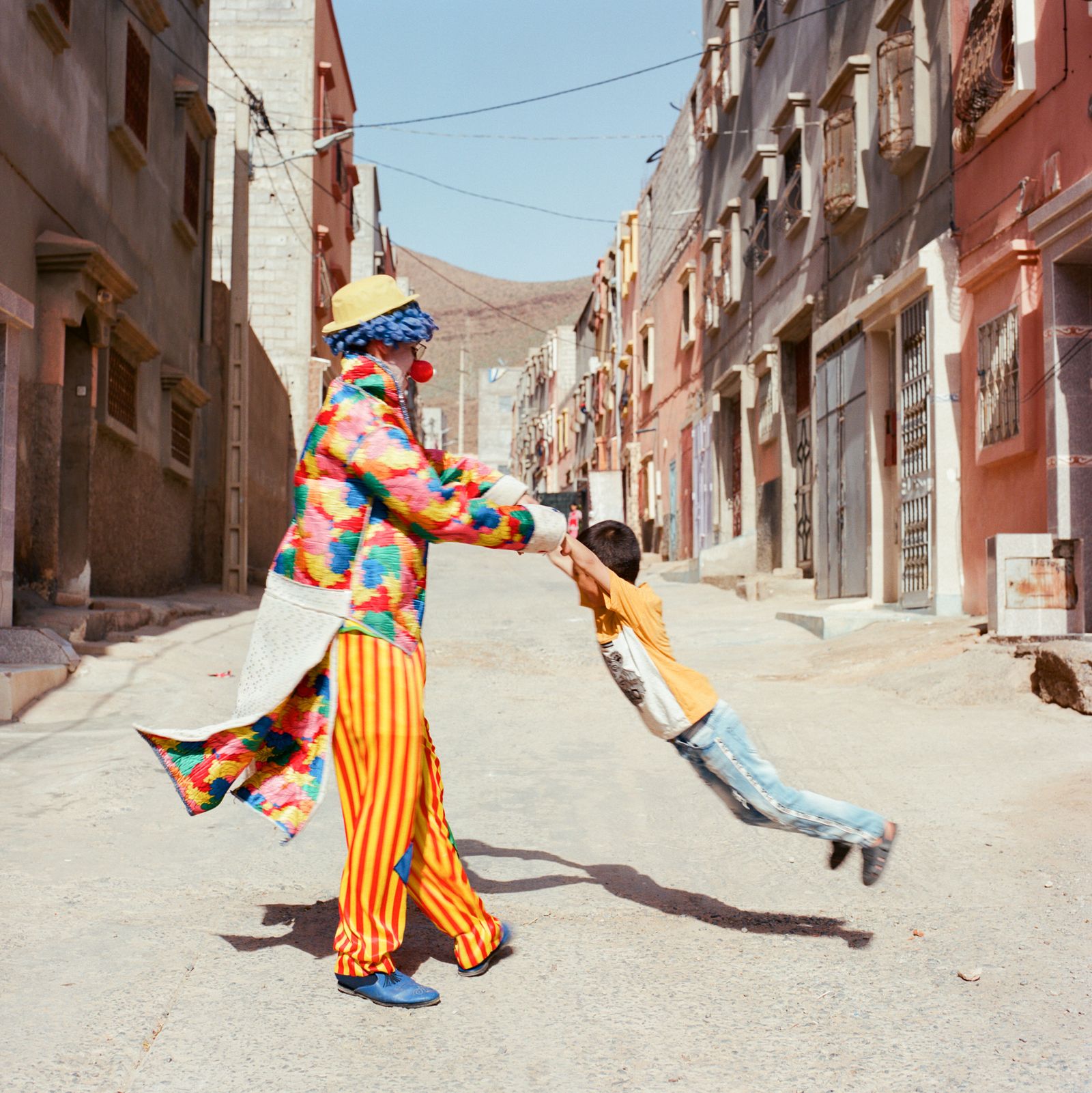 © M'hammed Kilito - A clown playing with a child in Guelmim