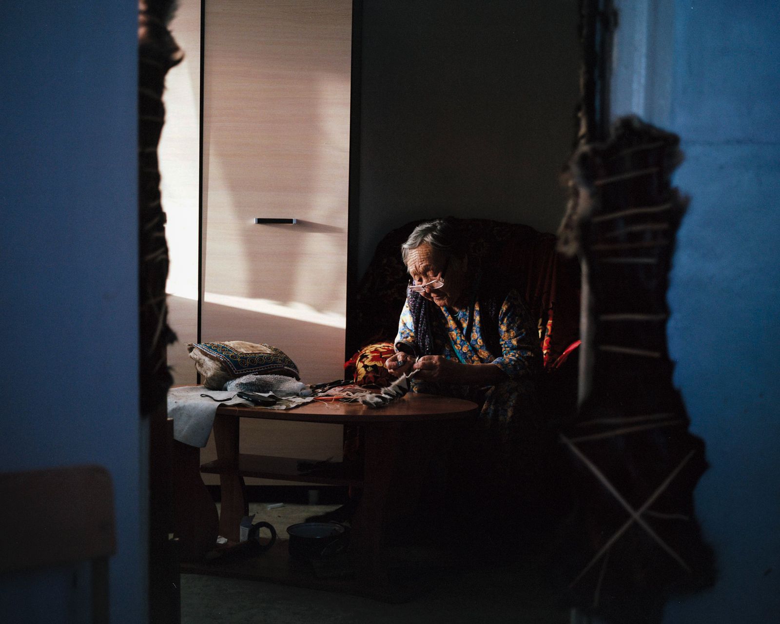 © alexis pazoumian - A Yakut grandmother who is sewing clothes with reindeer skin. From Yakutsk © Alexis Pazoumian