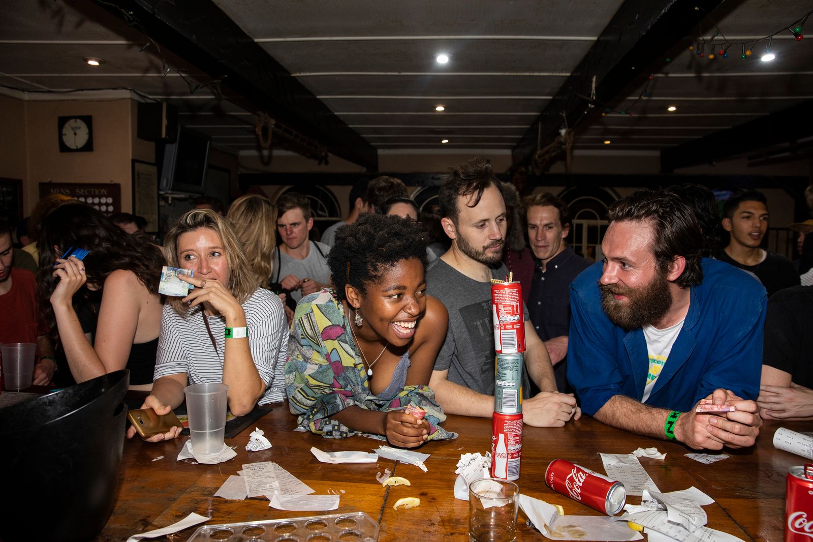 © Ilvy Njiokiktjien - People try to order drinks at a concert of Desmond and the Tutu's in a bar in Parkhust, Johannesburg, South Africa.