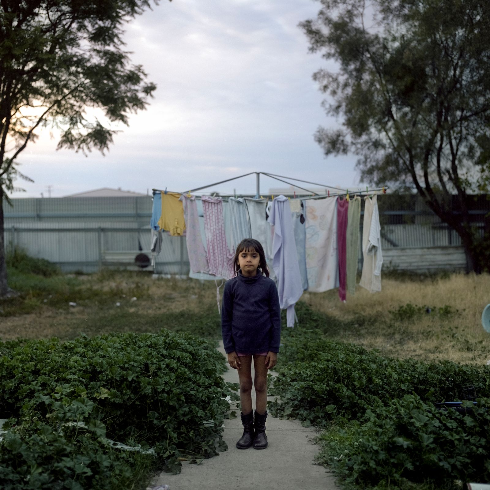 © Raphaela Rosella - Laurinda stands in her back yard.