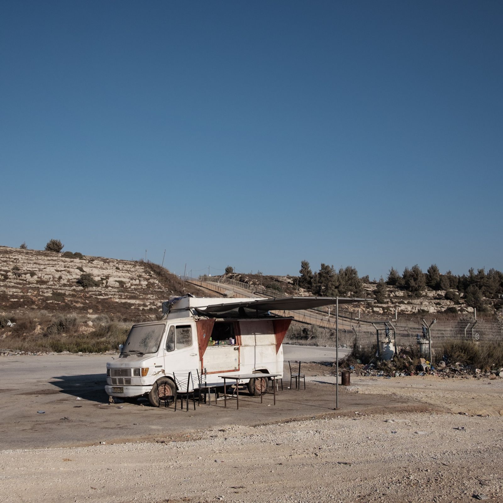 © Antonio Faccilongo - Ofer, Palestine.A bus bar where families await the release of prisoners from Ofer prison.