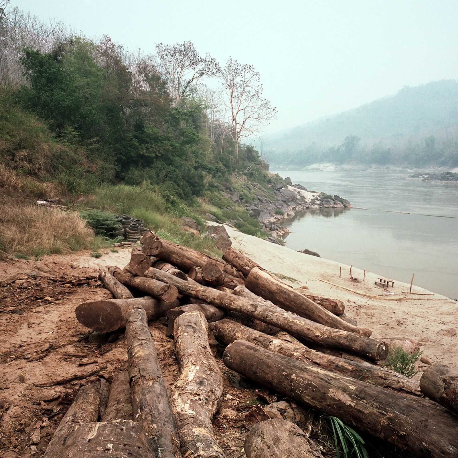 © Huiying Ore - Loggers in Laos make use of the Mekong River to transport felled trees from remote areas of the forest.