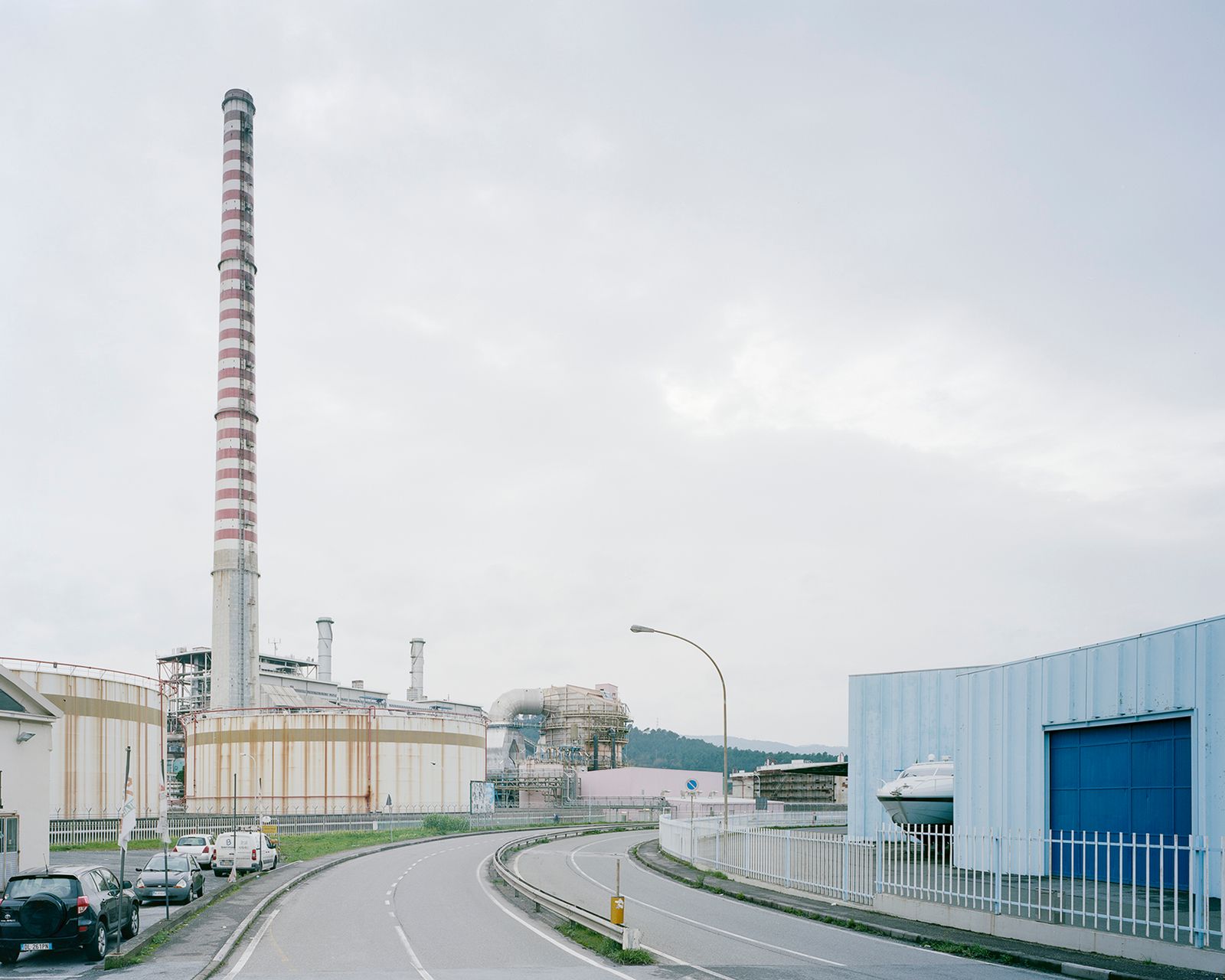 © Pietro Viti - The tall chimney of the “Eugenio Montale” coal plant, in the industrial zone of La Spezia. La Spezia, 2015.