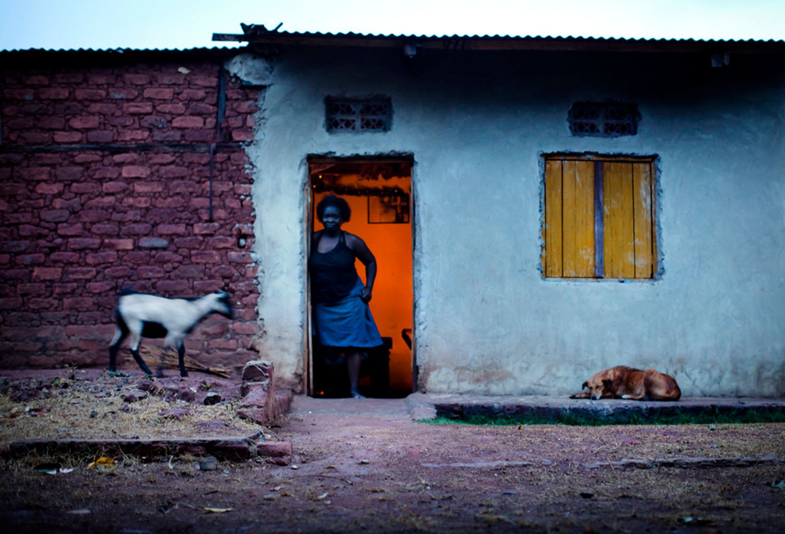 © Anne Ackermann - Irene, 29, stands in front of her house. She lost one of her legs when she stepped on a landmine 12 years ago.