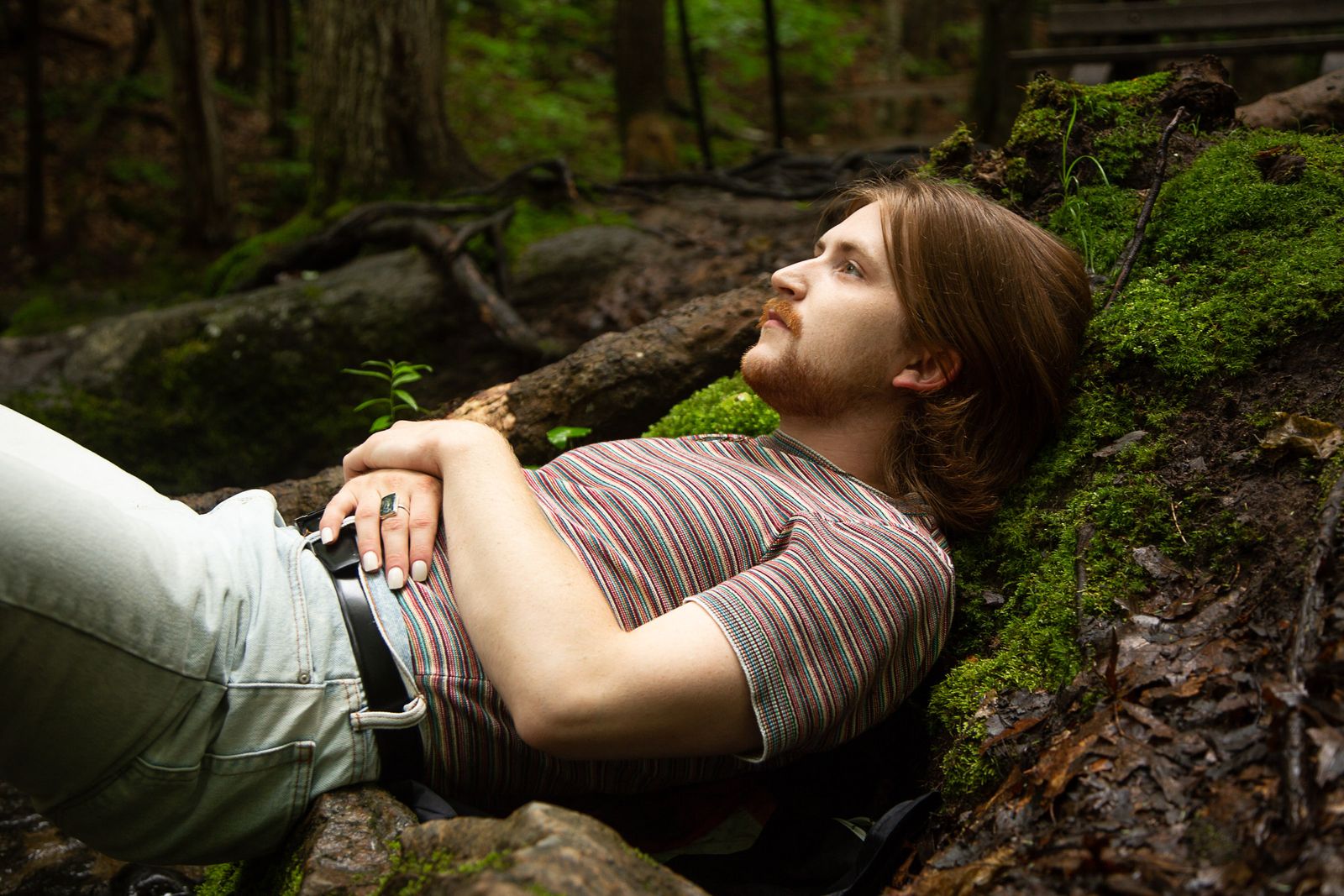 © Lindsay Morris - Danny relaxes on moss-covered boulders after a rigorous hike near his home (2021).