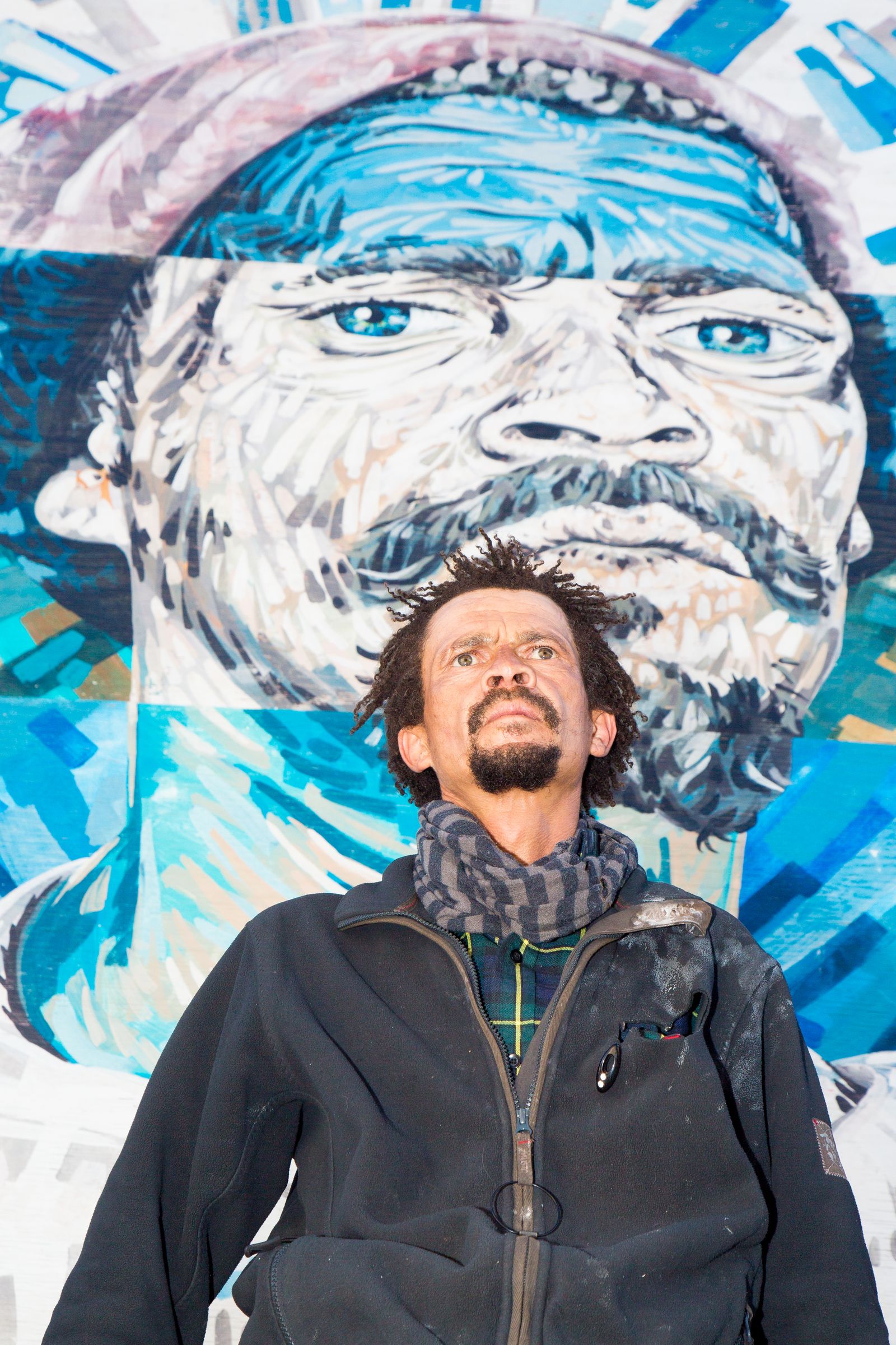 © Marzahn Botha - Romeo Clark poses in front of a picture on a canvas of his in Gardens, Cape Town.