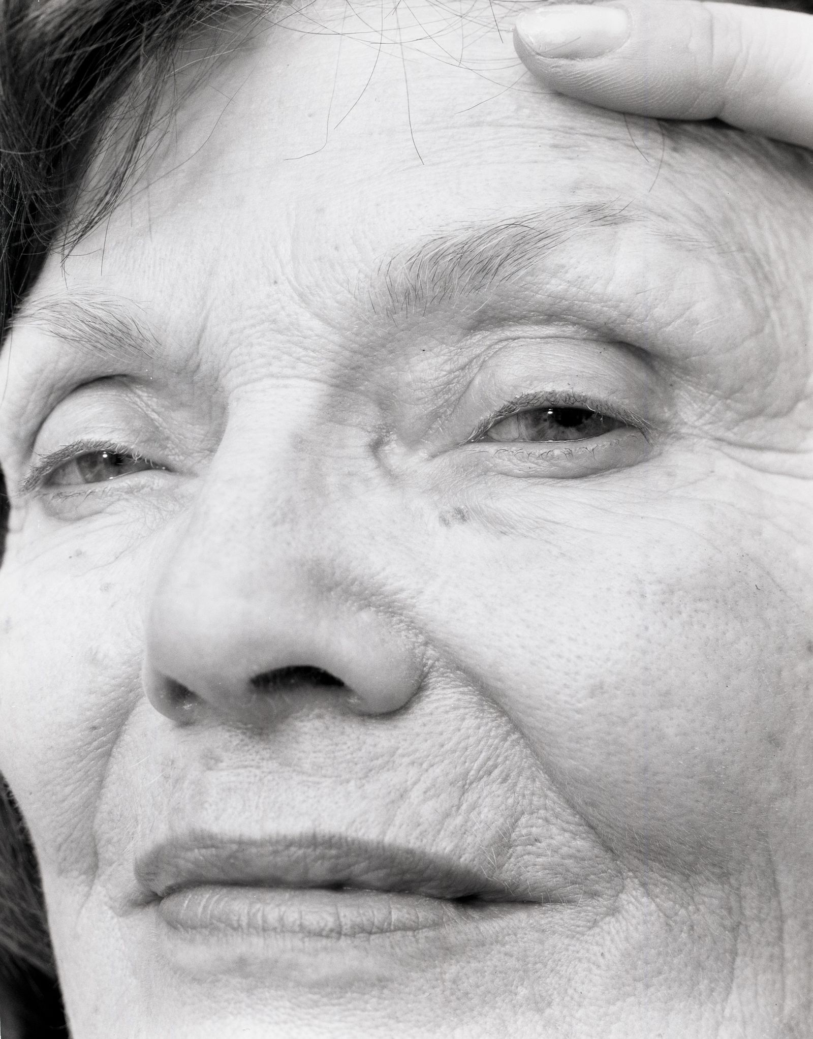 © Jillian Freyer - In a closeup of my grandmother's face, I hold her hair out of her eyes.