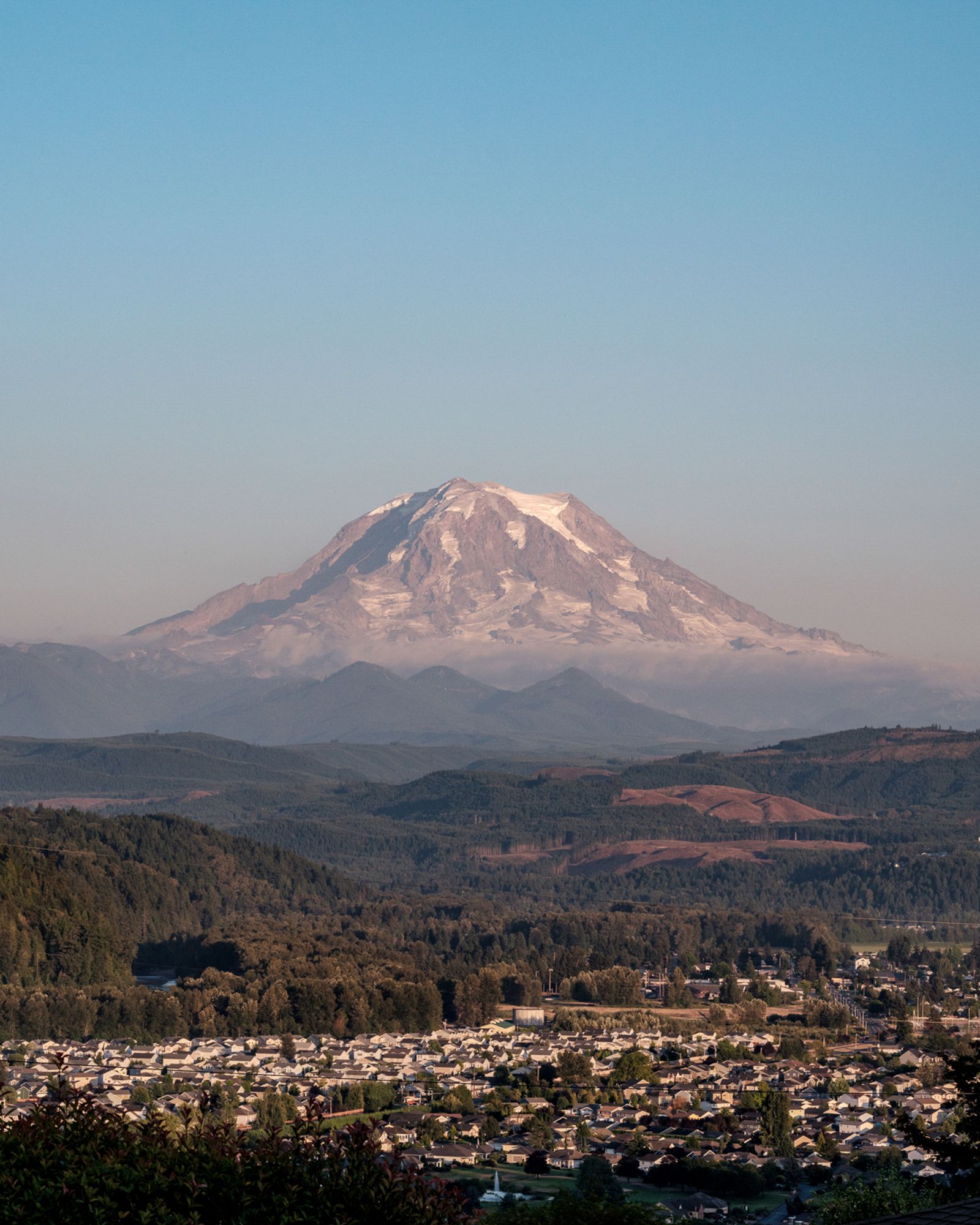 © Alana Celii - Mt. Rainier looming over the town of Orting as seen from South Hill, WA.
