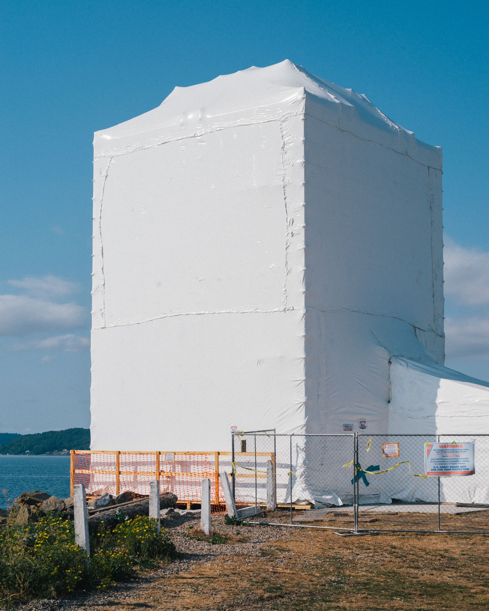 © Alana Celii - The Browns Point Light House during restoration. The lighthouse sits at the east entrance of Puget Sound's Commencement Bay.