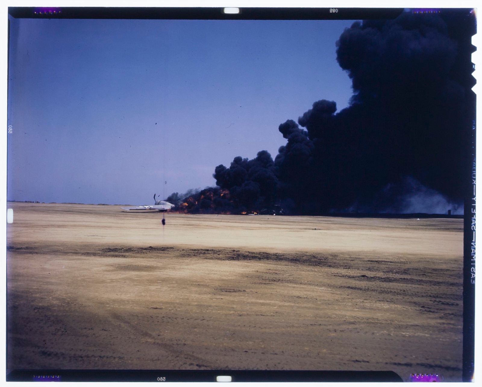 © Marianne Ingleby - A US fighter plane explodes, presumably Iwo Jima in spring of 1945.