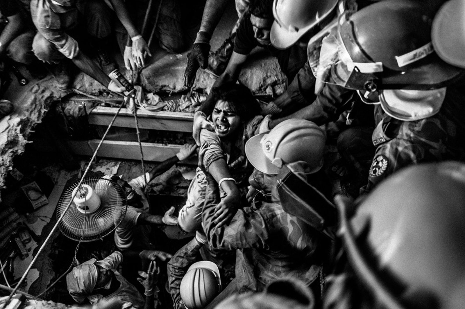© Rahul Talukder - A rescued worker screams at the first sight of light after being trapped for 73 hours inside the rubble.
