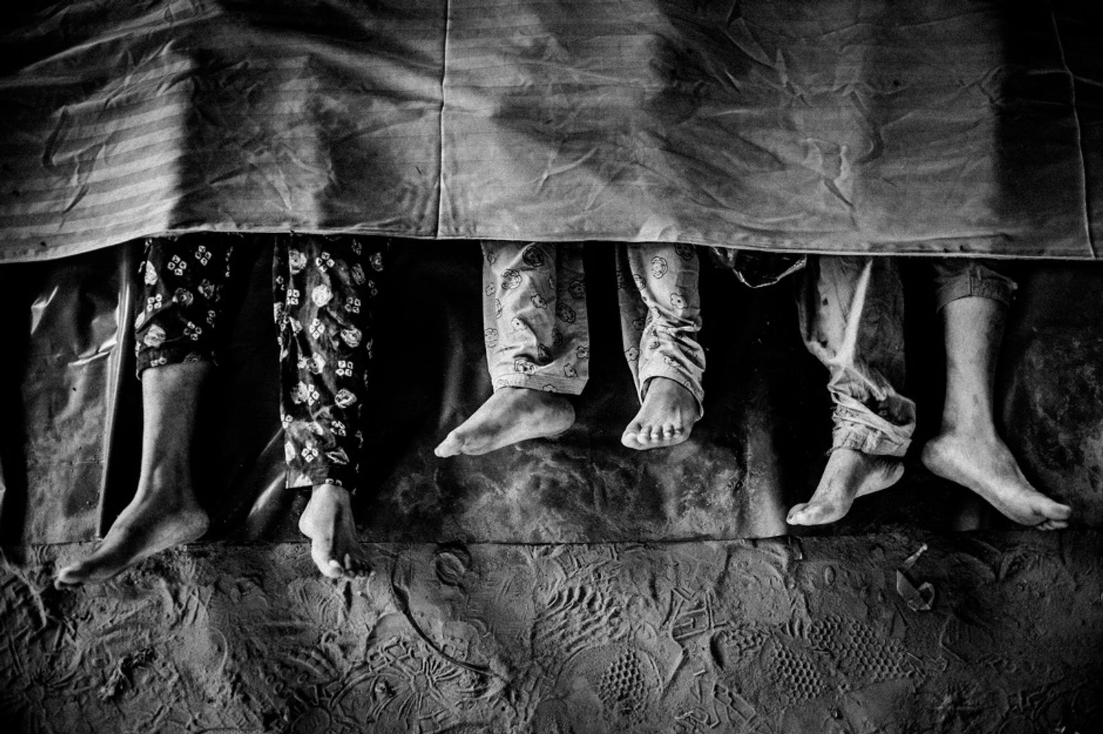 © Rahul Talukder - Lifeless bodies of the victims of Rana Plaza lie in the hospital morgue.