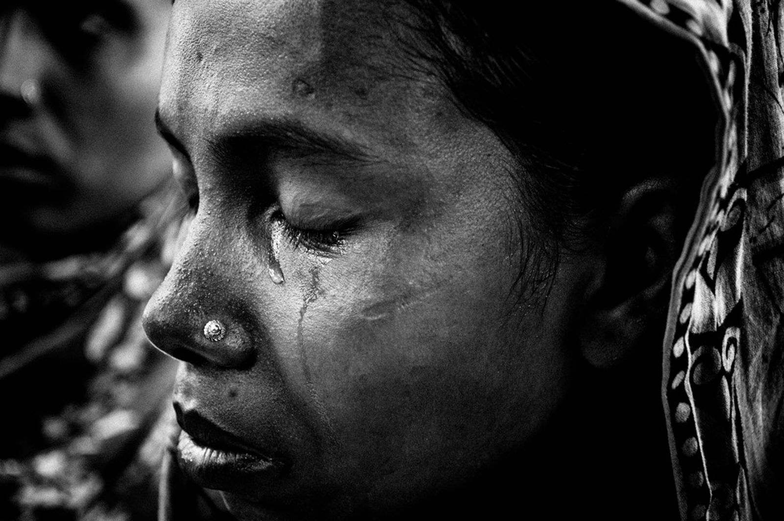 © Rahul Talukder - A woman grieves for a missing family member who used to work in one of the garment factories of Rana Plaza.