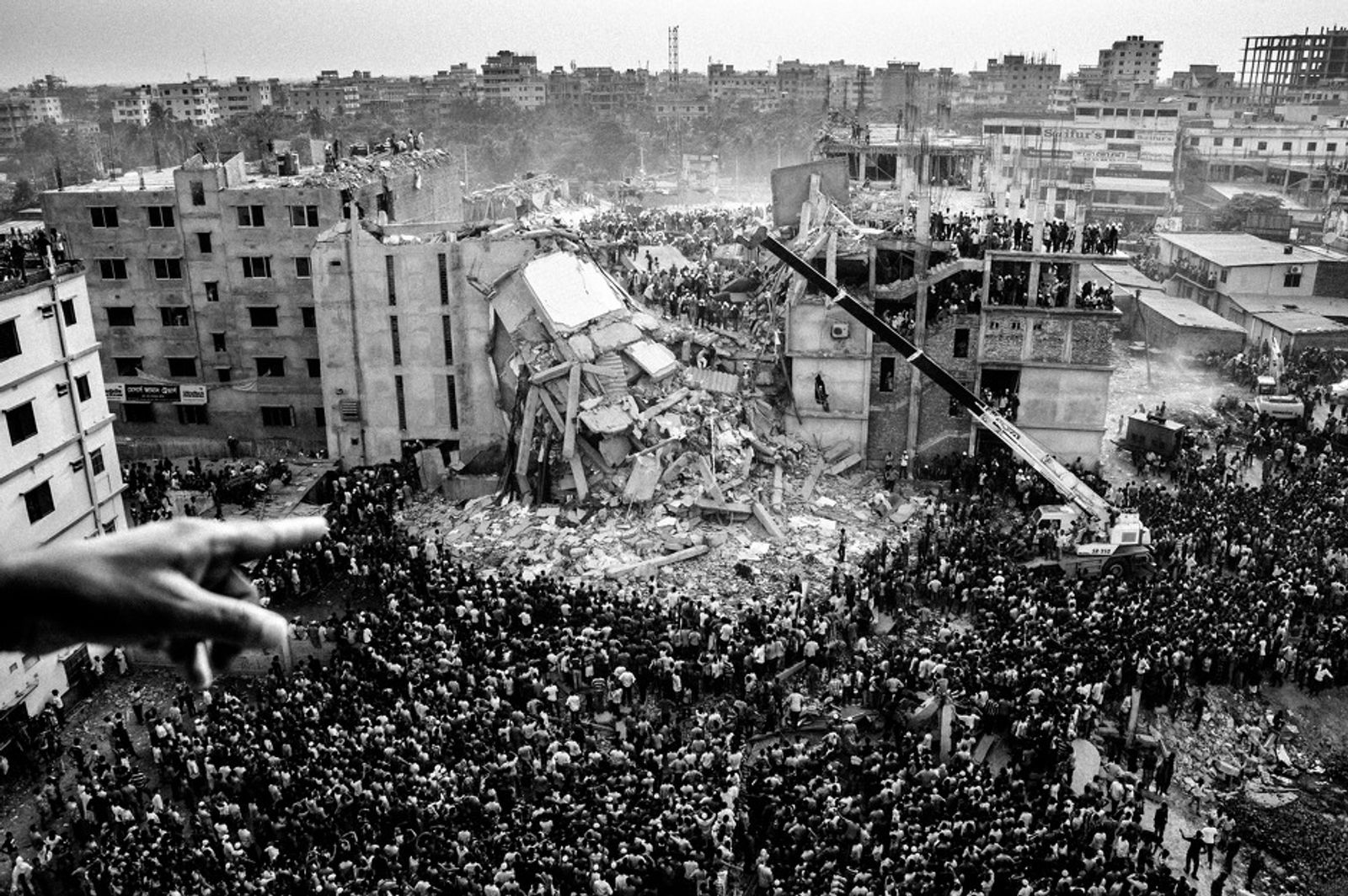 © Rahul Talukder - View of the collapsed building from a nearby rooftop.