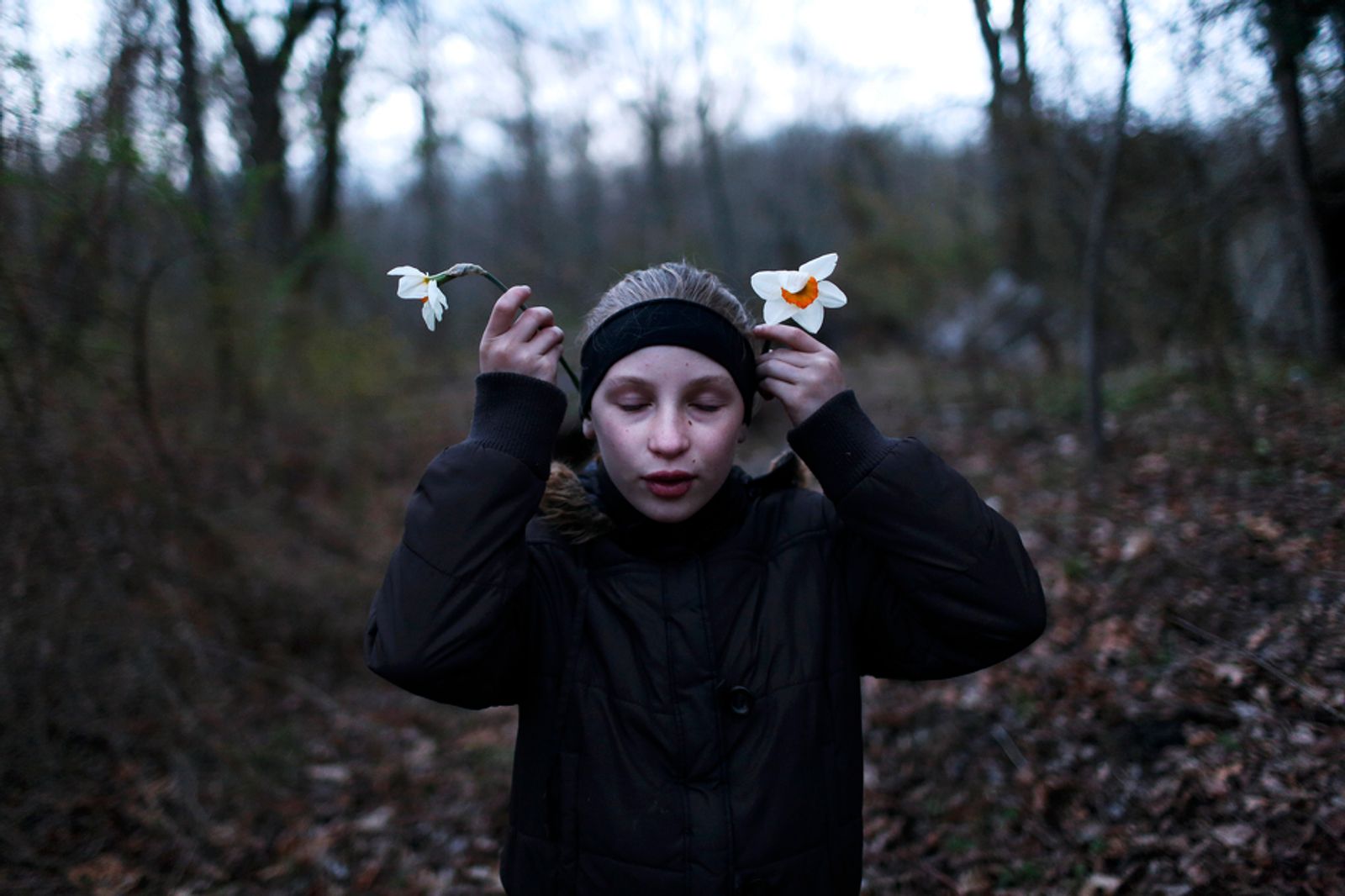 © Maddie Mcgarvey - Sonya picks wildflowers on a long walk.