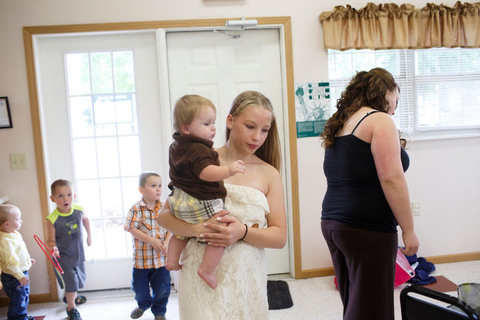 © Maddie Mcgarvey - Sonya carries around her cousin before her aunt's wedding.