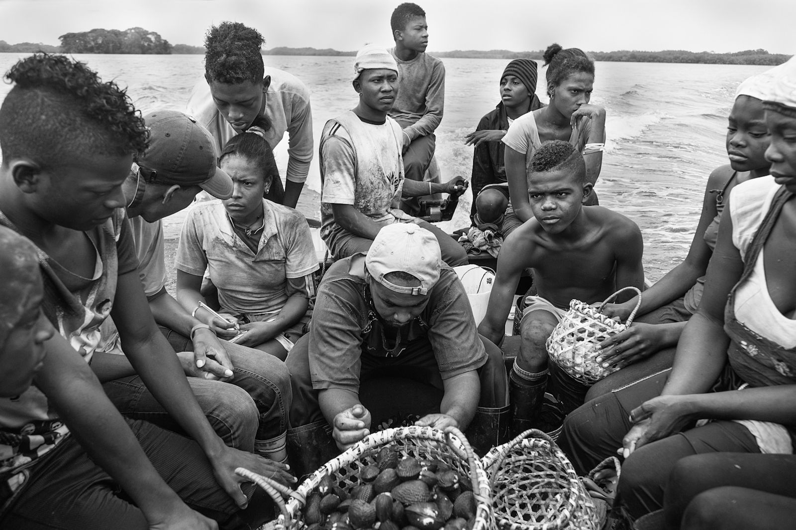 © Felipe Jacome - A group of shell pickers go back to their community after 5 hours of working in the .Cayapas Mataje Reserve. 2014