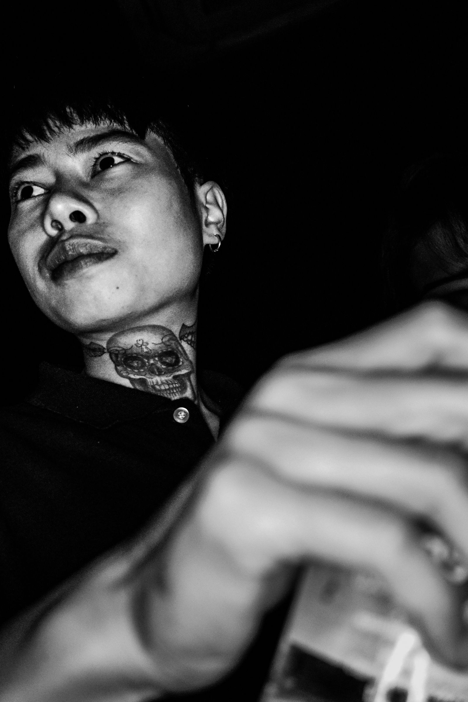 © JANUSZ DAGA - A tattoo on the neck, a short haircut and a cigarette.