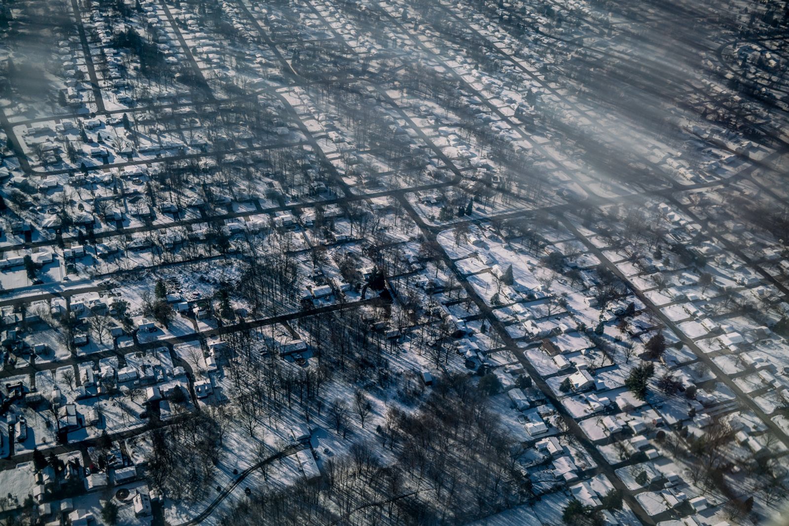 © Zackary Canepari - Flint, Michigan from a dirty plane window.