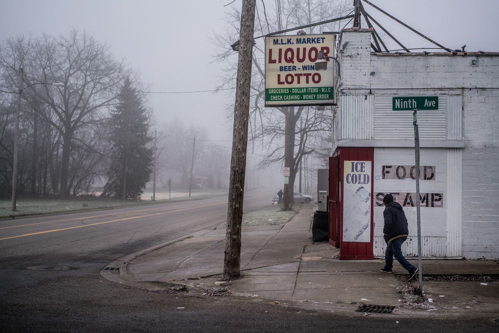 © Zackary Canepari - A party store in Flint on a foggy morning.
