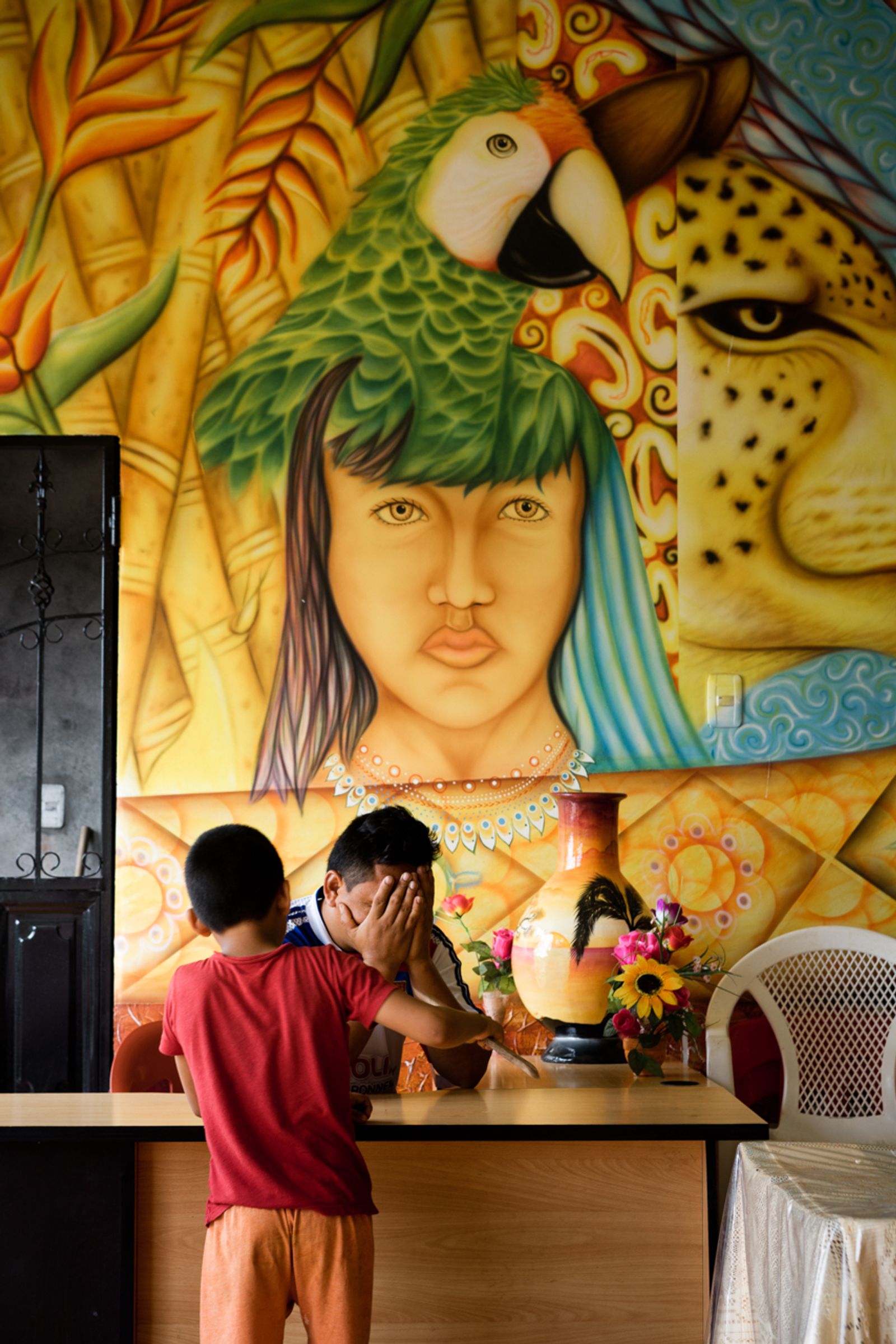 © Misha Vallejo - A boy approaches his father in their small restaurant in Puerto Nuevo, Ecuador.