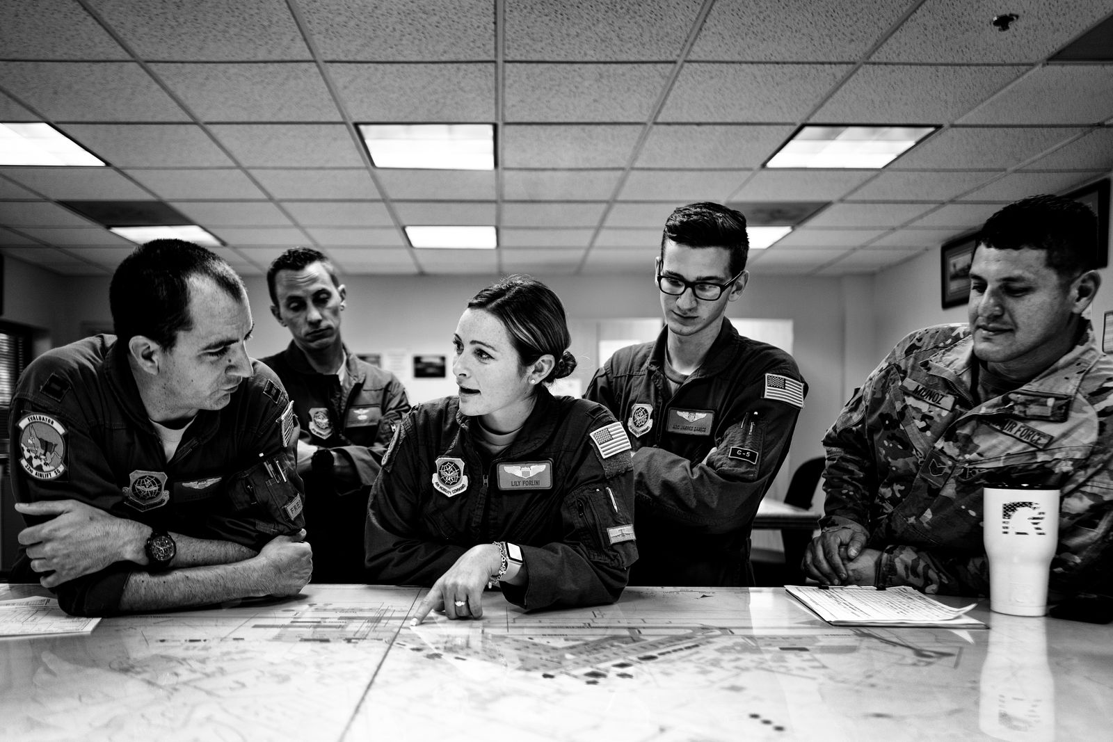 © Katerina Christina - Lily converses with members of her squadron at the mission planning center.