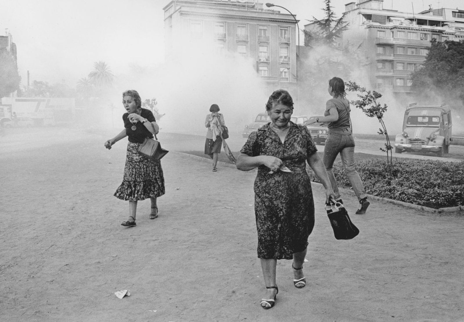 © Julio Etchart - Women suffer from tear gas during a demonstration against Pinochet on International Women's Day. Santiago; Chile, 1985