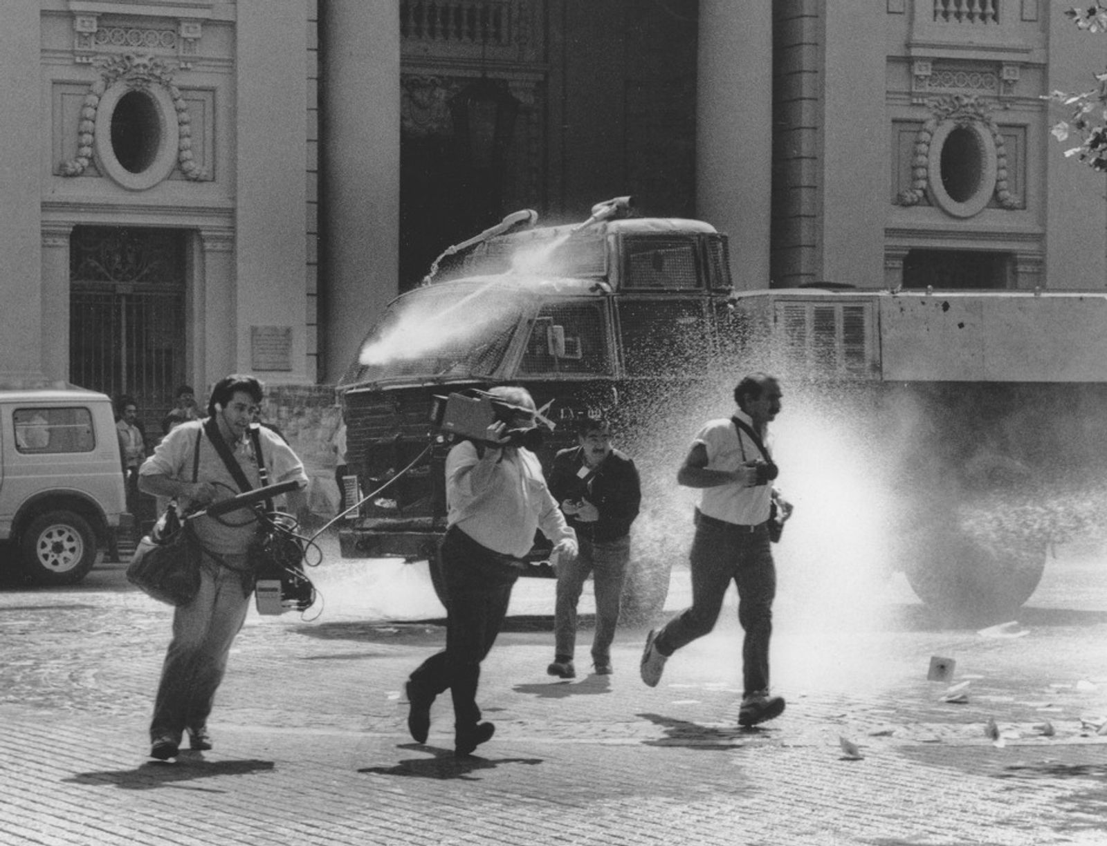 © Julio Etchart - Journalists attacked by water-cannon during the 'NO' referendum campaign against Pinochet in 1988. Santiago, Chile,