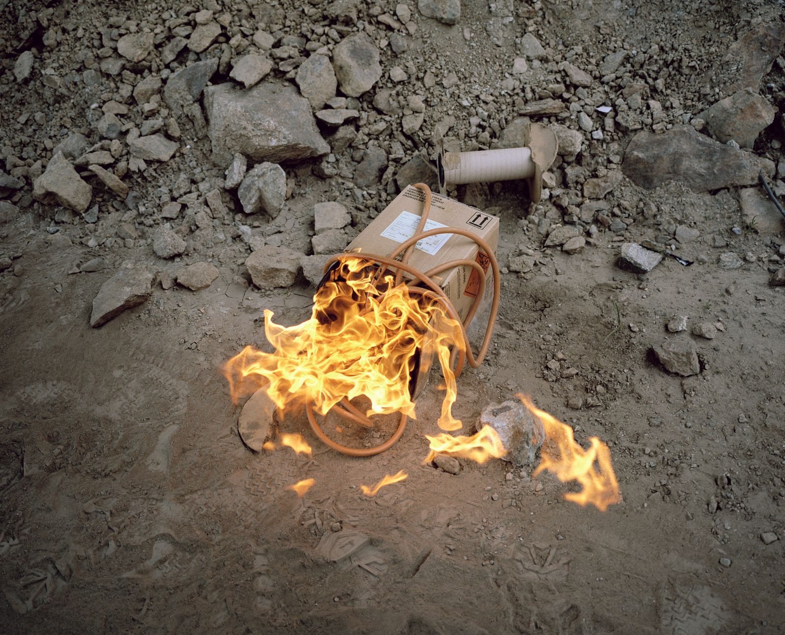 © Filippo Menichetti Martin Errichiello - Leftovers of a detonating cord are burned after a controlled demolition.