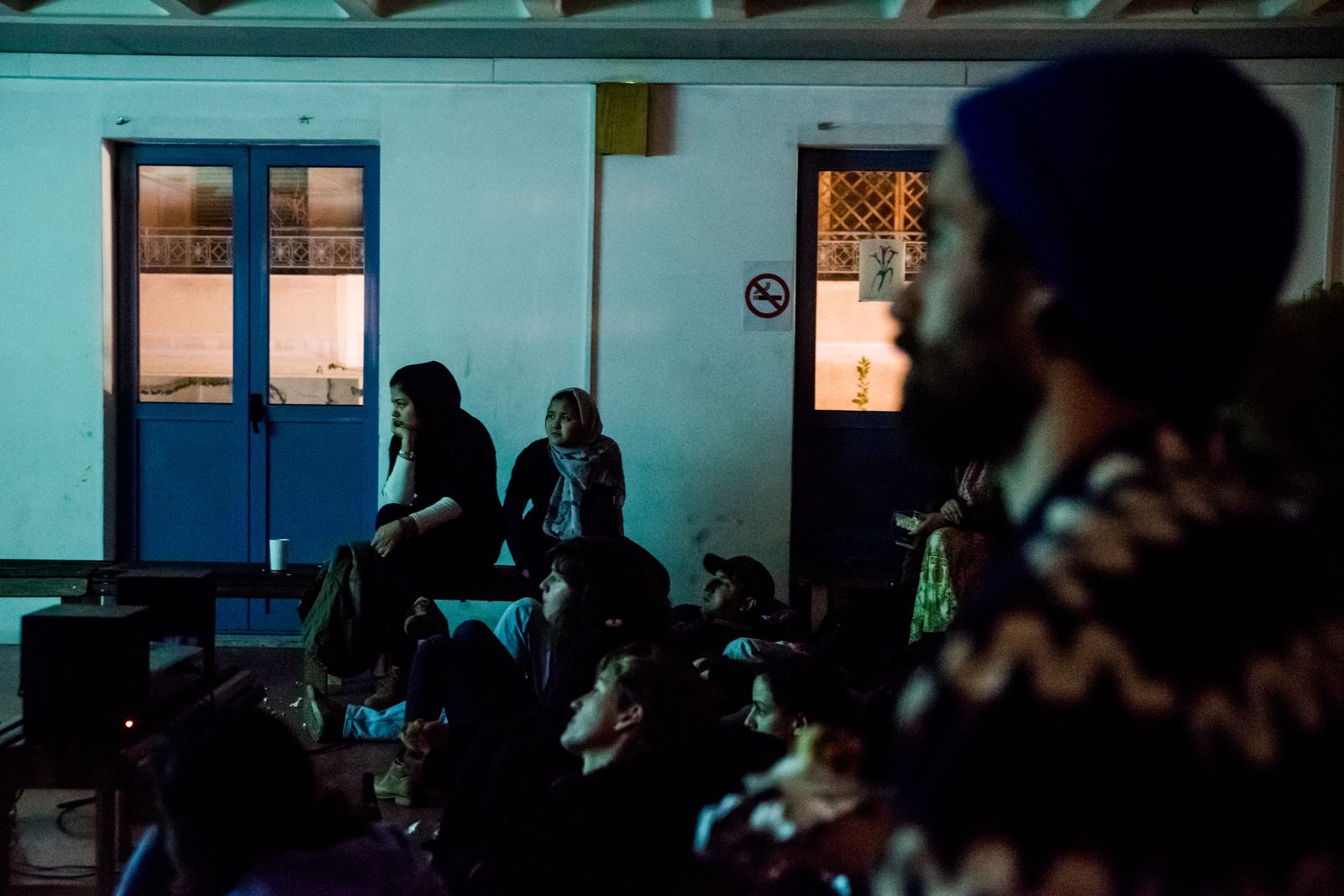 © Zoltán Balogh - Refugees, volunteers and activists watch a movie in Khora Community Hall in Athens, Greece, 01 December 2016.