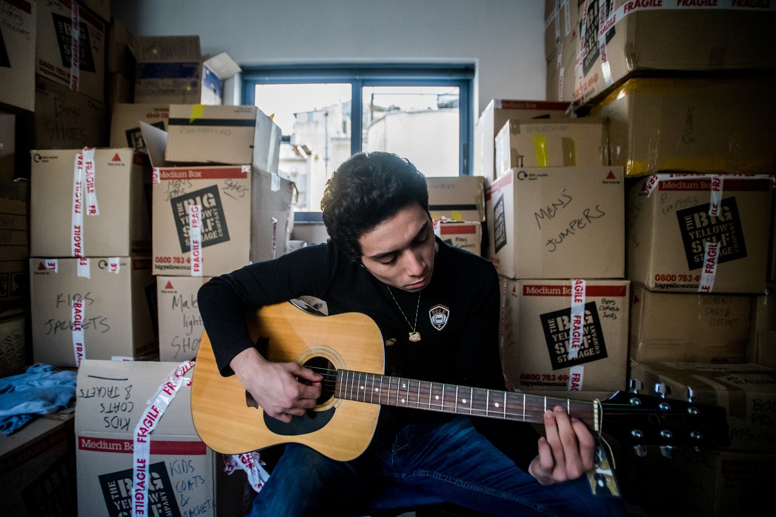 © Zoltán Balogh - A refugee man plays the guitar in Khora Community Hall in Athens, Greece, 01 December 2016.