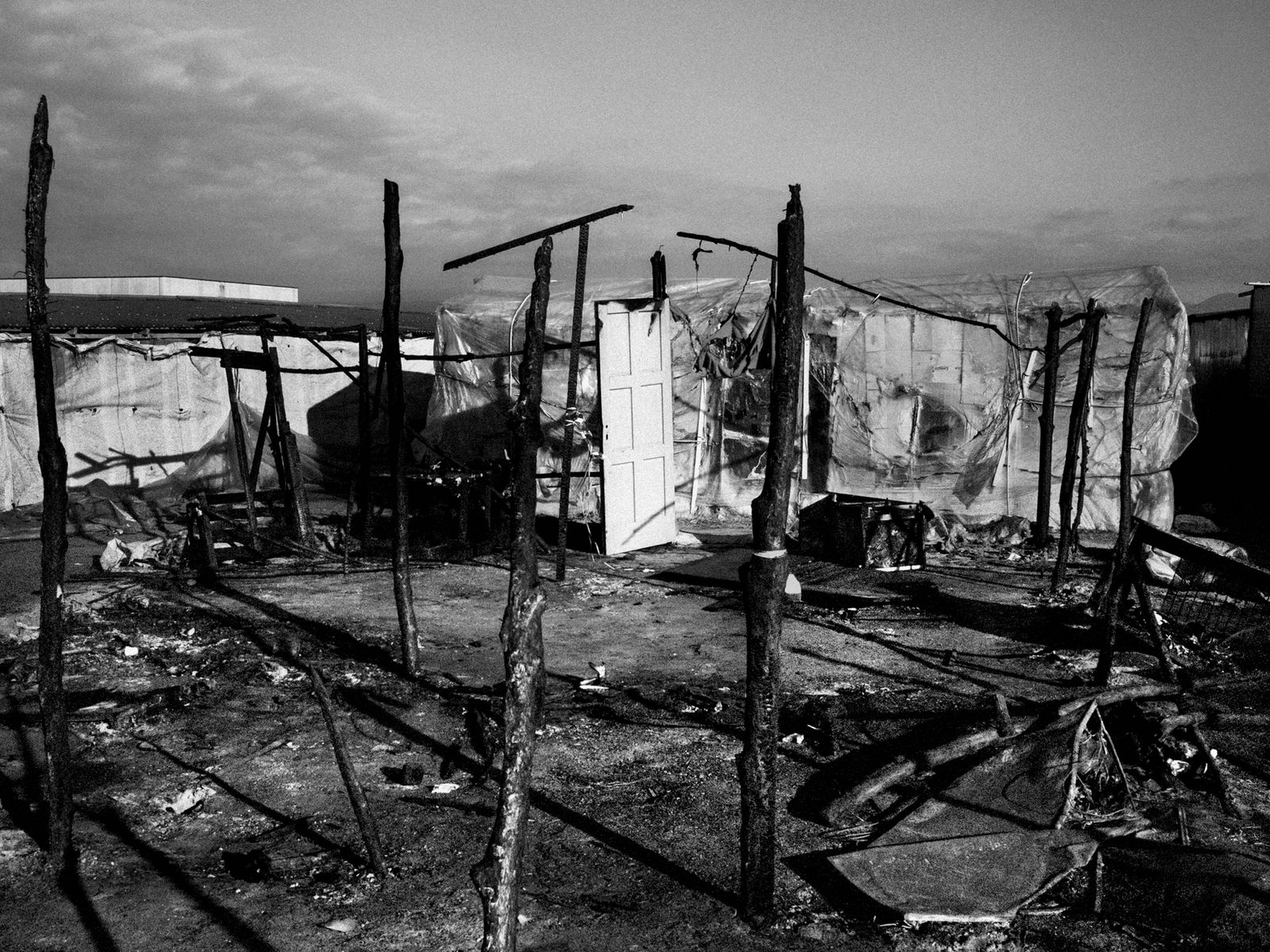 © Marco Zanella - Italy. 2019. San Ferdinando, Calabria. Remains of the barracks after a big fire in the seasonal migrant workes slum.