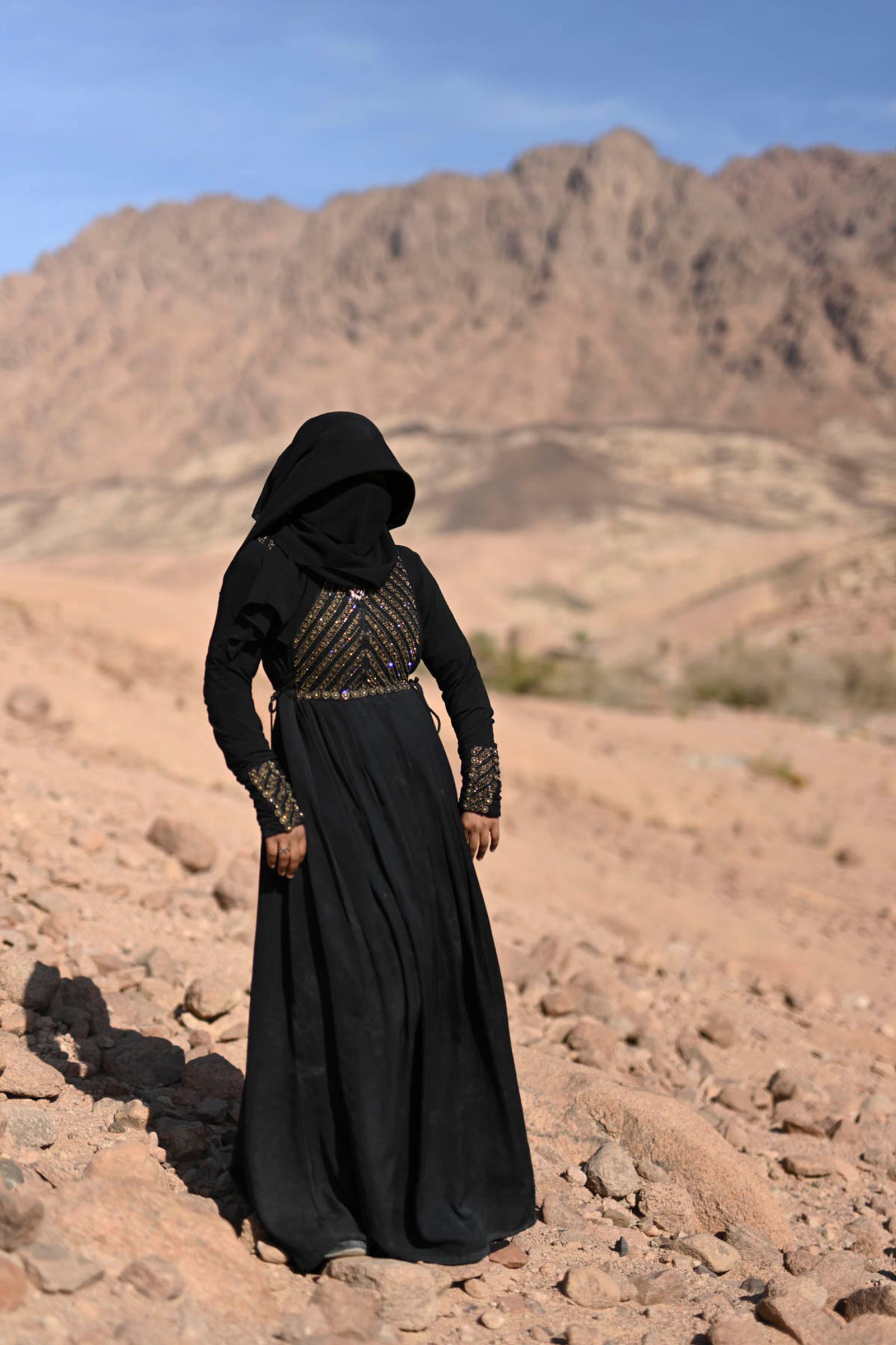 © Rehab Eldalil - Hoda (23) from St. Catherine city stands on the edge of a hill looking over Gharba Valley. April 2019.