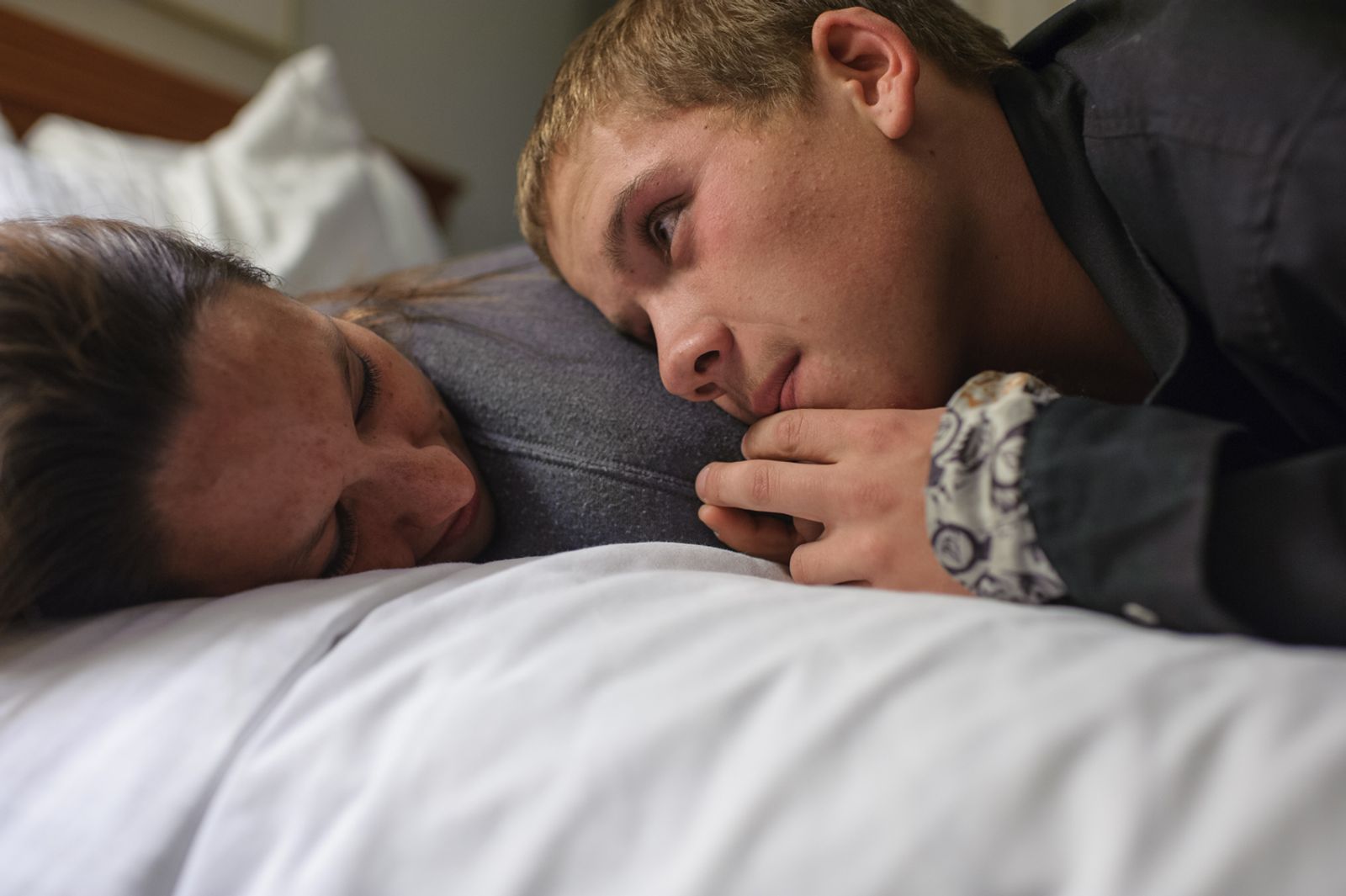 © Isadora Kosofsky - Vinny, age 16, looks at his girlfriend, Krystle, as they recline on a bed in Albuquerque, New Mexico.