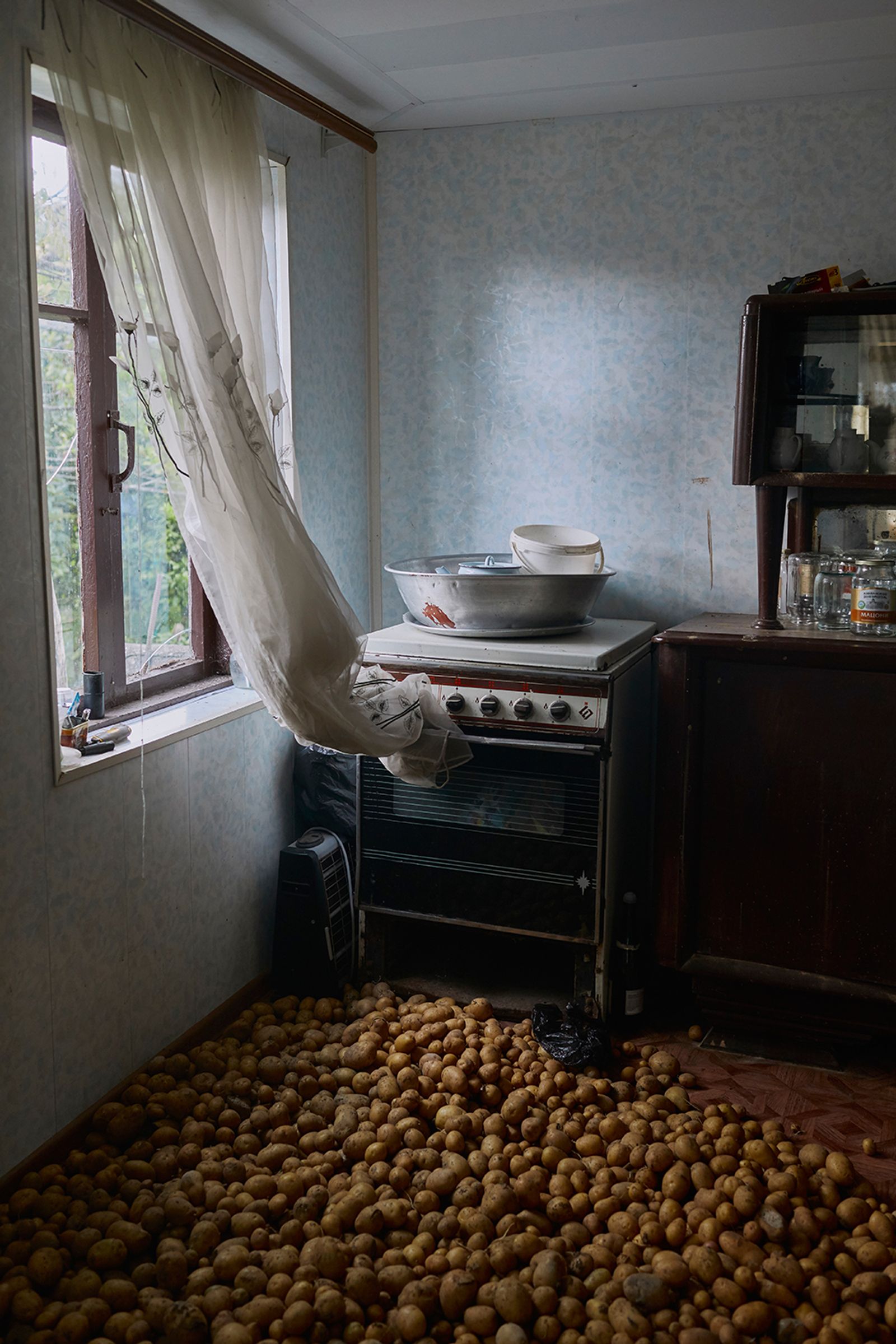 © Ksenia Kuleshova - Abkhazia, Eshera, 07/07/2017. Potatoes are stored on a floor in order for them to stay dry.