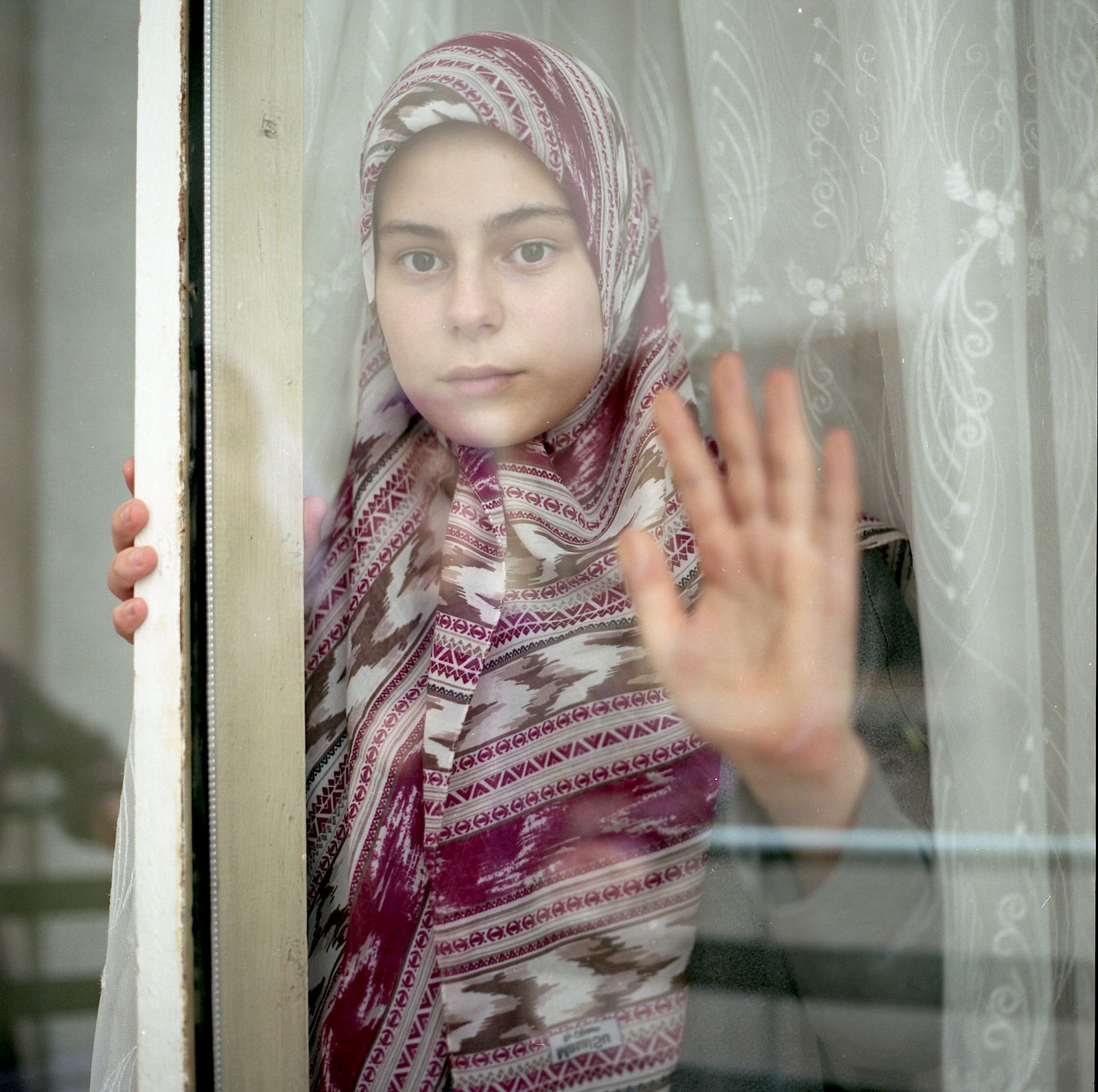 © Sabiha Çimen - A student looking out from the window the first day of the summer Quran school