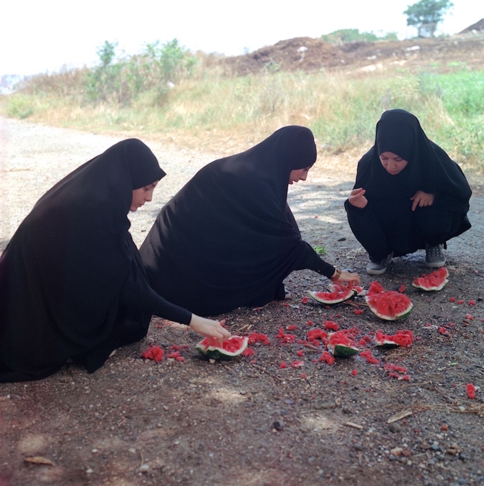 © Sabiha Çimen - Broken Watermelon. Turkey-Istanbul In a picnic event, girls are hanging and having fun around the broken watermelon.