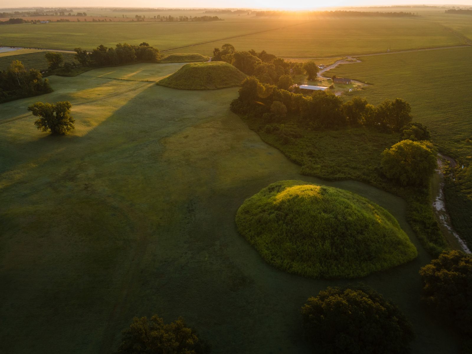 © Rory Doyle - First light casts on Native American mounds at the Winterville Mounds site in Winterville, Mississippi, USA.
