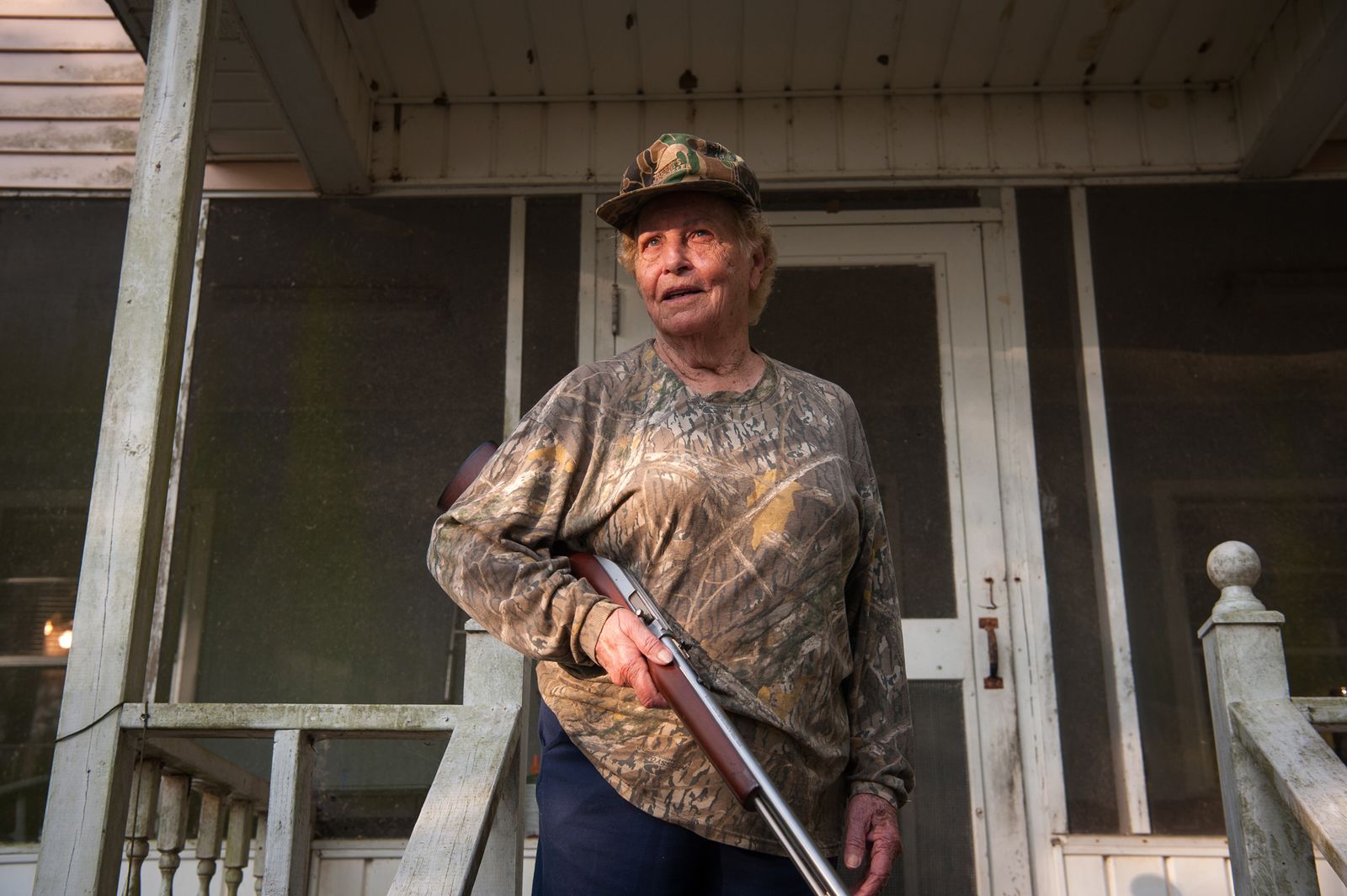 © Rory Doyle - Squirrel hunter Annie Mendoza, 85, poses for a portrait outside her hunting cabin in Bayou Sorrel, Louisiana, USA.
