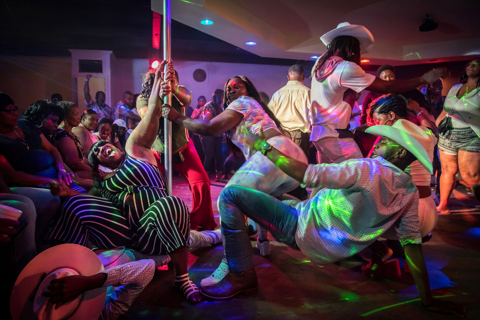 © Rory Doyle - A group of cowboys take to the dance floor at Club Black Castle in Ruleville, Mississippi on Sept. 3, 2018.