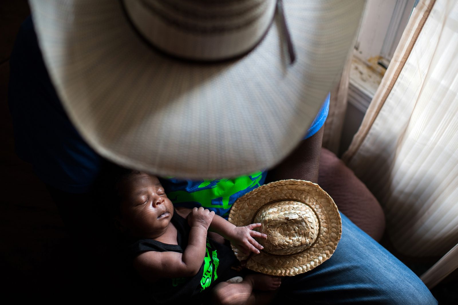 © Rory Doyle - Newborn Jestin Brown is held by his father, Jessie Brown, at their home in Cleveland, Mississippi on July 2, 2018.