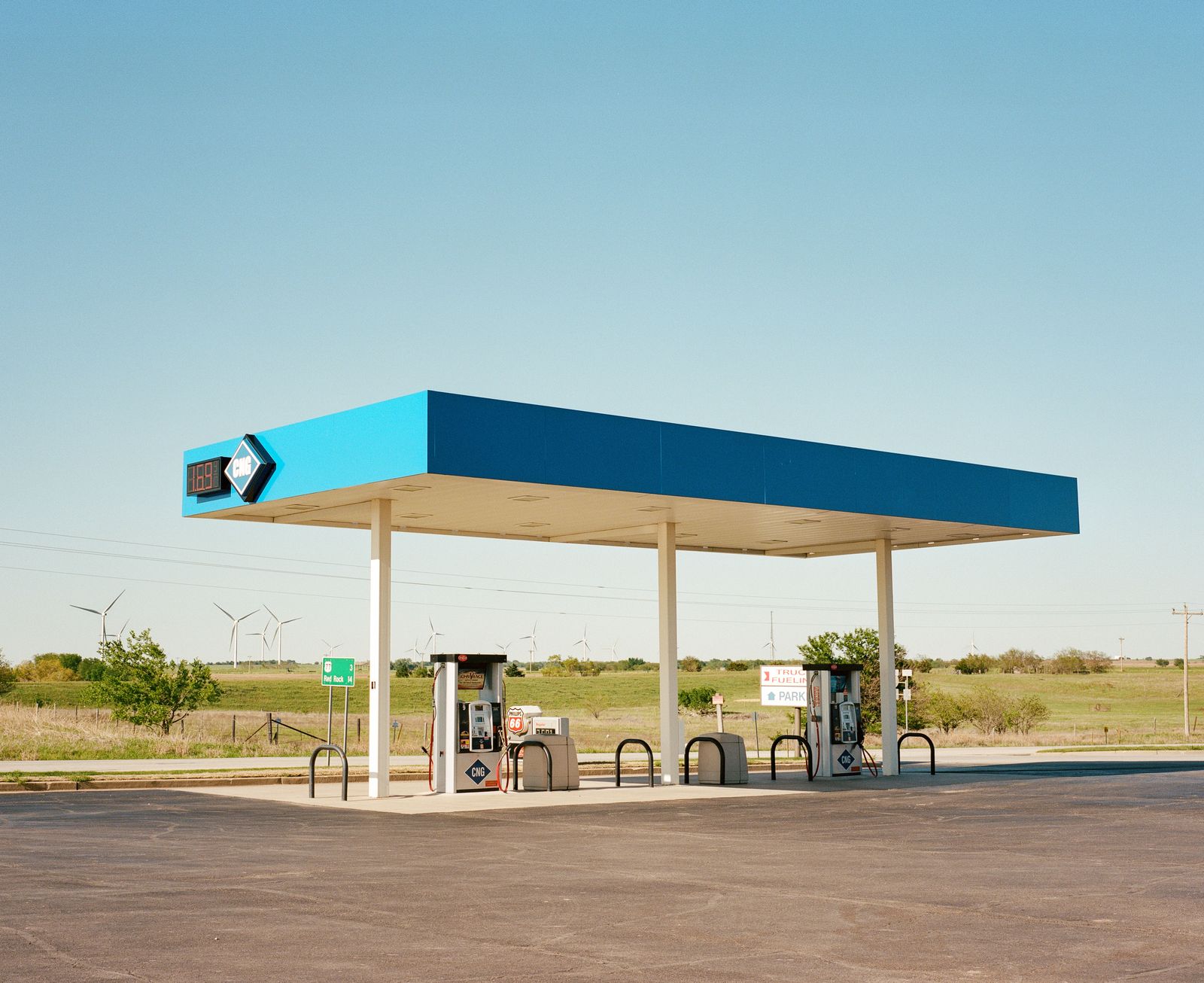 © Bailey Quinlan - Diesel station and wind turbines - Kansas