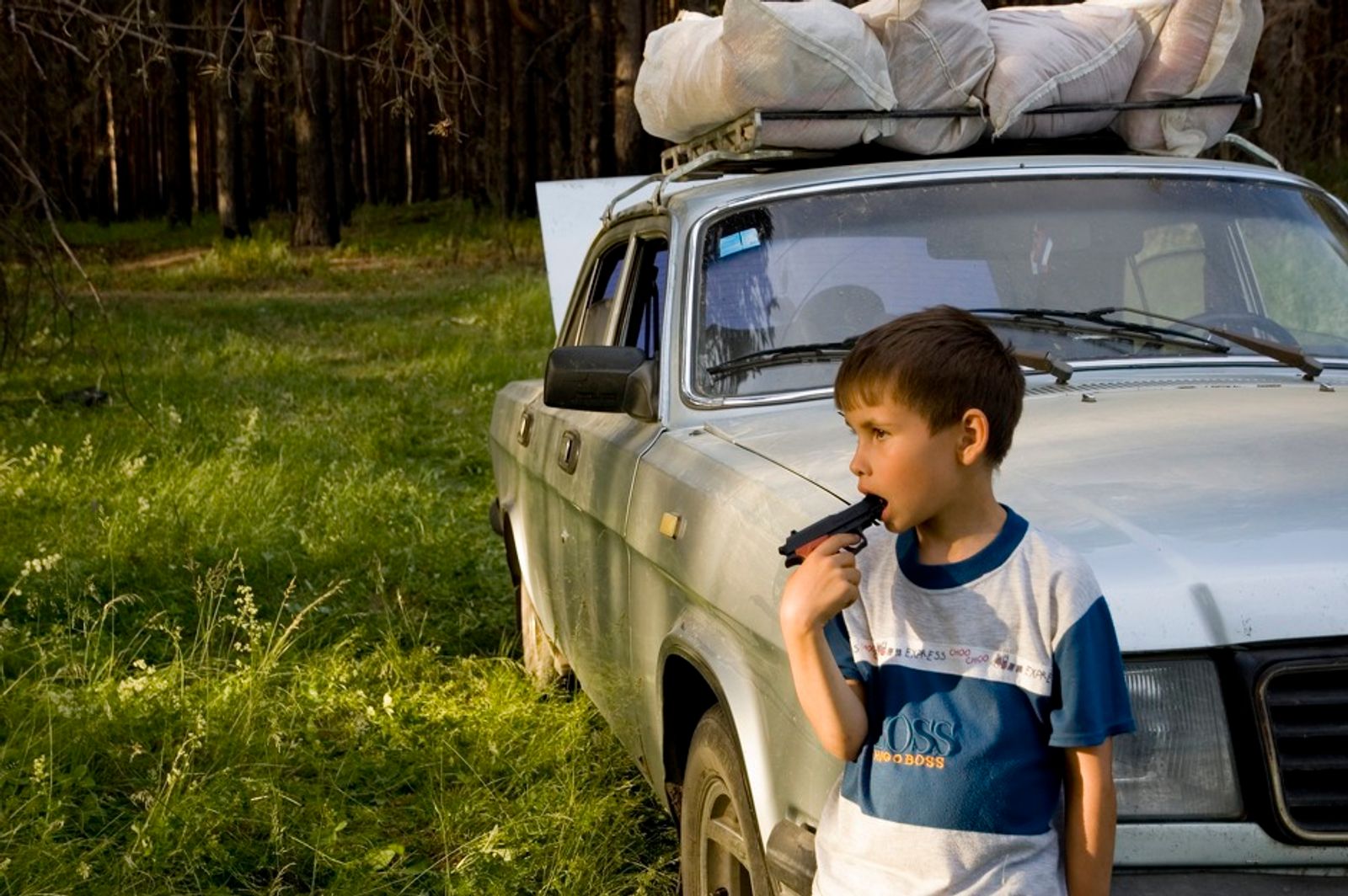 © Denis Tarasov - A boy with a toy gun. Sverdlovsk region, Russia.