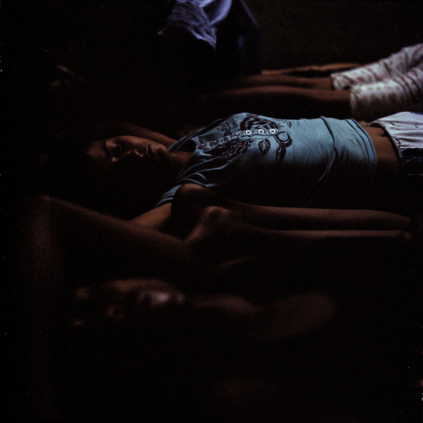 © Poulomi Basu - The last sleep with the family. Seema Sur asleep in her home in Jhargram, West Bengal. September 2009