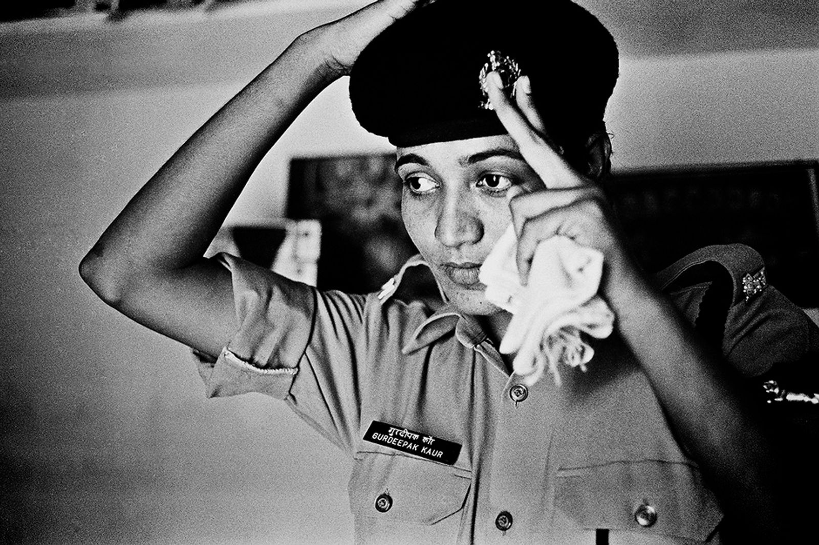 © Poulomi Basu - Kaur Walia, putting on her uniform at home before leaving for the border. Kharkan Chowk Village, Punjab September 2009.