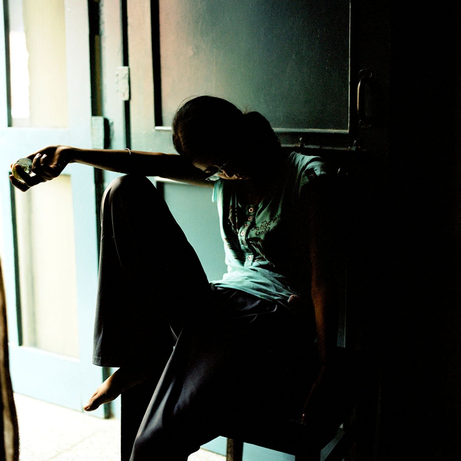 © Poulomi Basu - Manpreet Soni, pensive and quiet at her home in Jalandhar, July 2009.